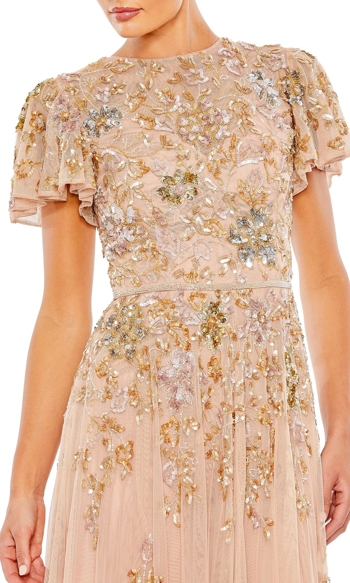 A woman wearing the Short Sleeve Beaded Formal Dress: Mac Duggal 5717, a blush pink gown with short sleeves, featuring gold and silver floral embroidery and embellishments.